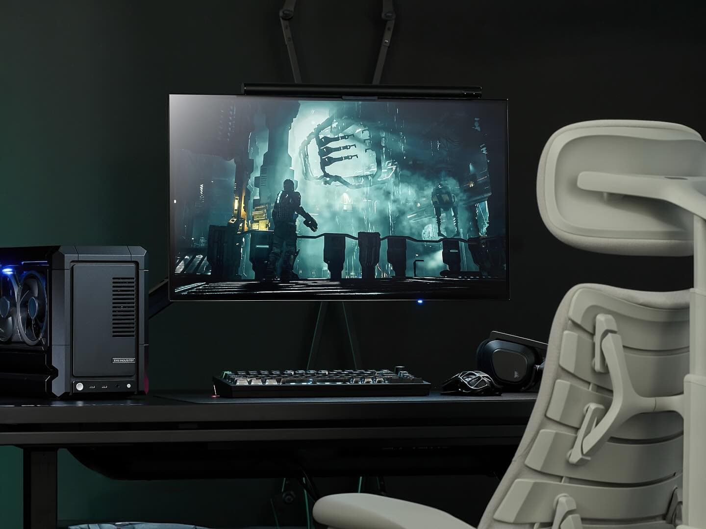 Gaming desk with a monitor, computer, and ergonomic chair